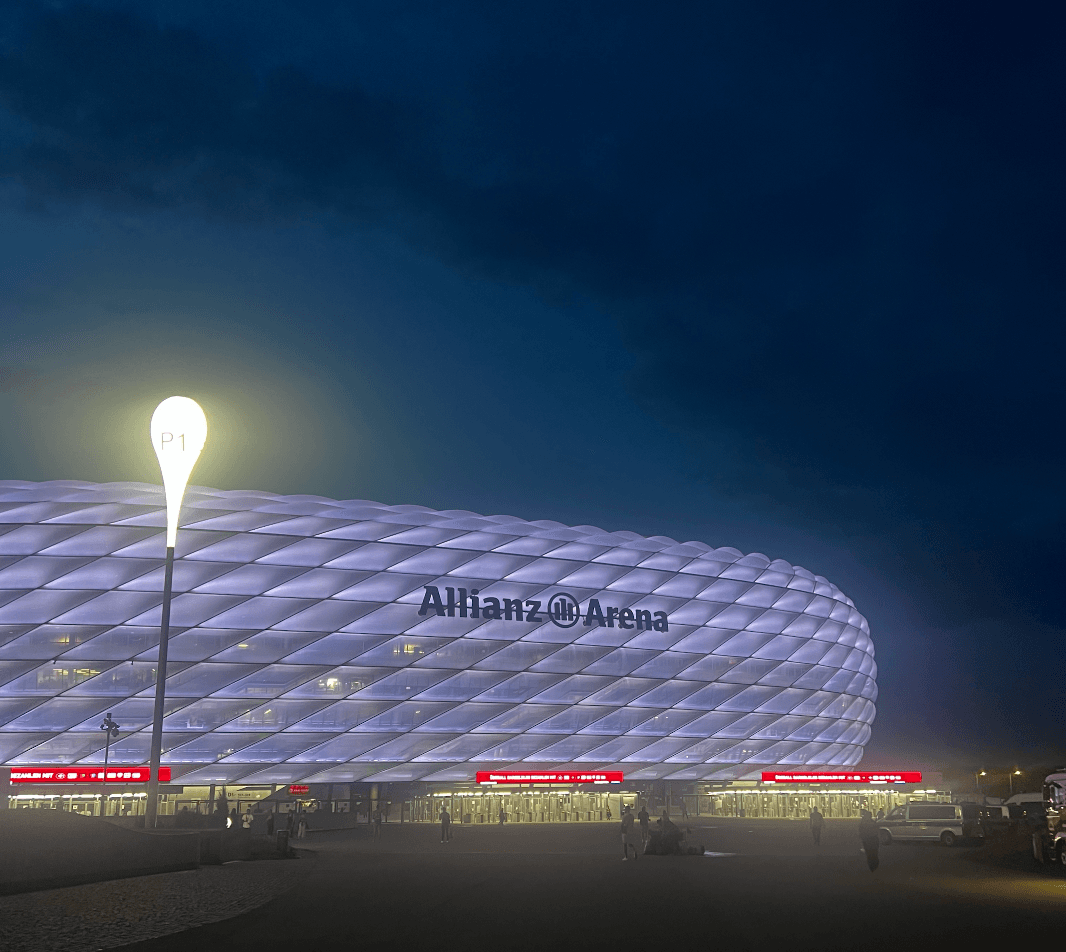 Allianz Arena lit up at night during a Bayern Munich home match