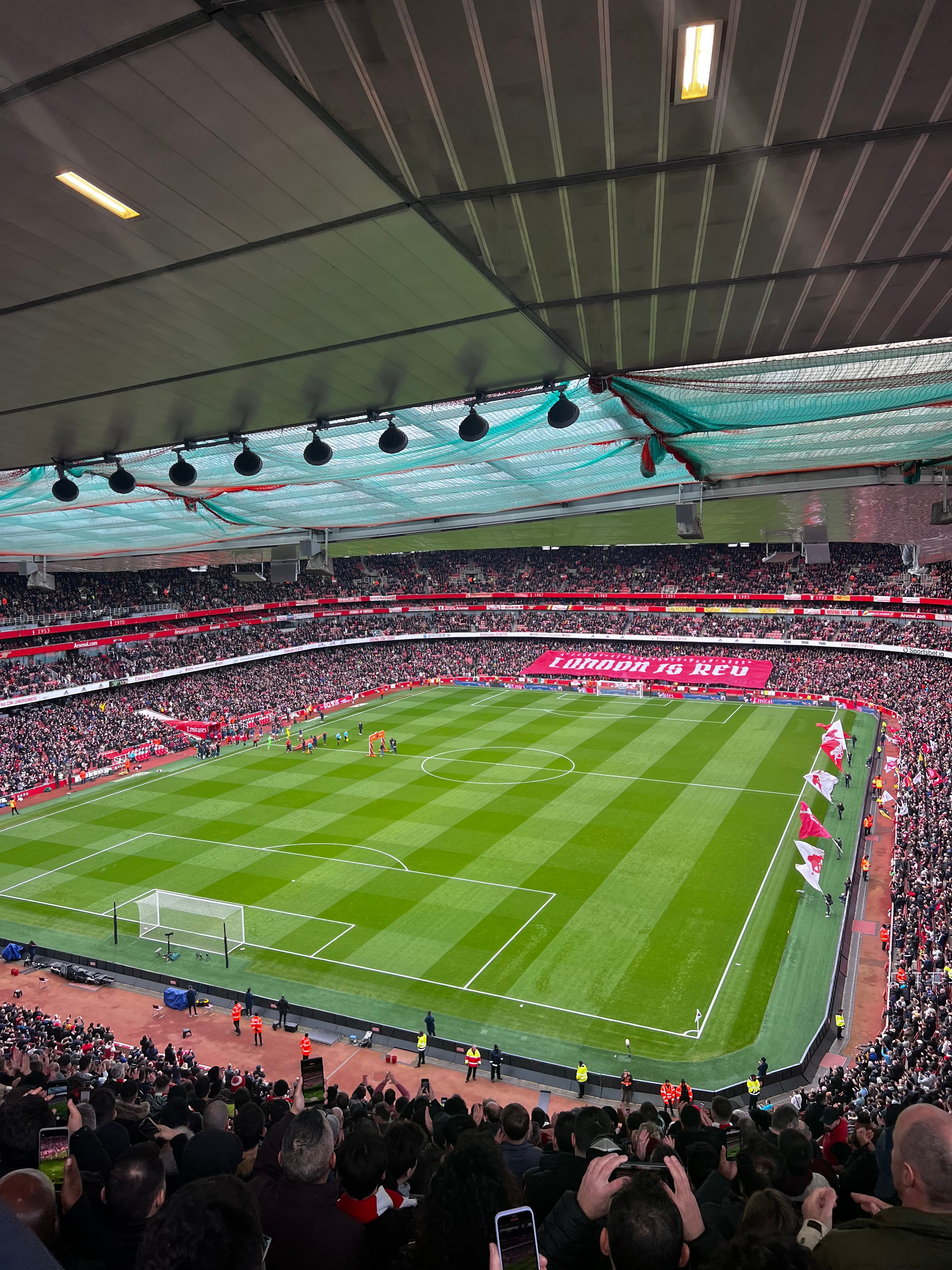 Emirates Stadium North Bank upper tier view full stadium Arsenal match panoramic pitch view 60000 capacity sellout crowd